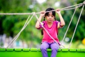 20760440-crying-little-asian-girl-sitting-alone-on-a-playground-outdoor